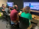 Two father-son duos at Augusta University's ARC (WA4AUG), operating from the university's Emergency Operation Center. Left to right: KN4MXG (Matt) with son KN4MXH (Matthew), and Andy (AA5JF) with son Sage (KO4BUR).
